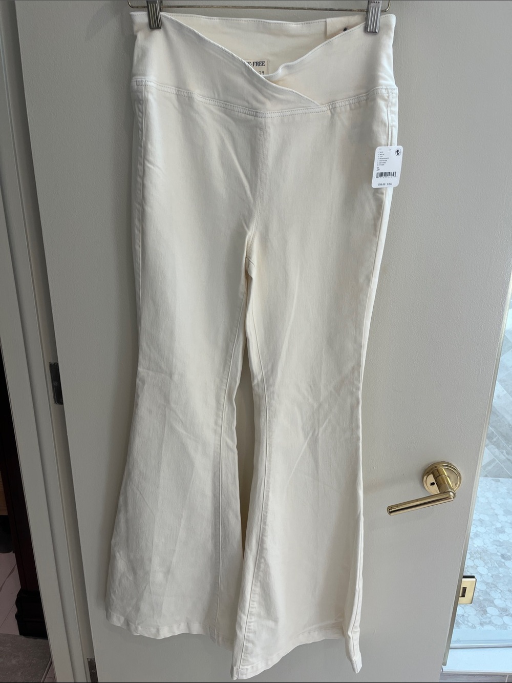 We The Free Cream Flare Jeans with V Crossover Waistband